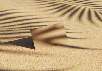 Blank business card mockup on sand with palm leaf shadows