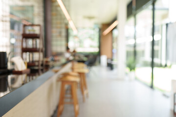 Blurred modern cafe interior with bar stools and counter