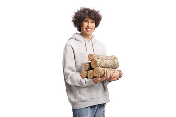 Young man holding a pile of firewood
