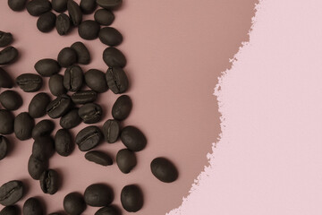 coffee beans are randomly arranged on the left on a pink beige background