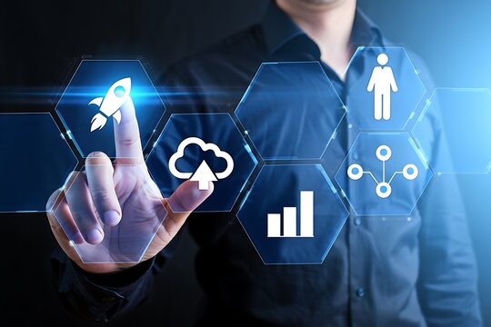 A person interacts with a futuristic digital interface displaying hexagonal icons representing a rocket launching cloud upload bar graph and network connection symbols the interface glows with
