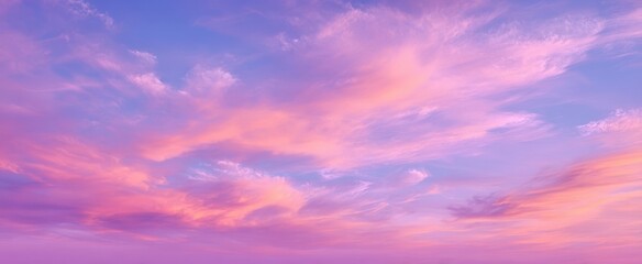 Fototapeta premium The serene beauty of a pastel sunset sky filled with wispy clouds.