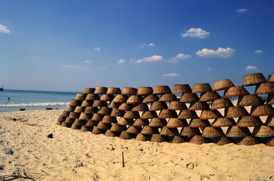Row of fisherman round baskets at Colva beach, Goa, India