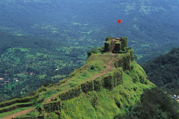 Saffron flag flying on Pratapgadh fort, Mahabaleshwar Mahableshwar, Maharashtra, India