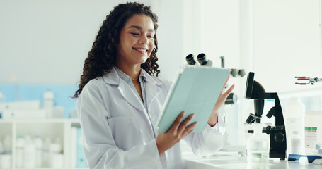 Naklejka na ściany i meble Research, woman and scientist in laboratory with tablet for project, discovery or experiment. Digital technology, medical science and female microbiologist with report for pharmaceutical innovation.