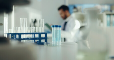Fototapeta premium Science, liquid and man with test tube in lab for chemical study, medical research and development. Healthcare, pharmaceutical and scientist with sample for forensic analysis, chemistry or experiment