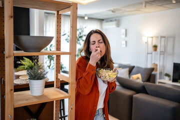 Woman disgusted by her salad at home