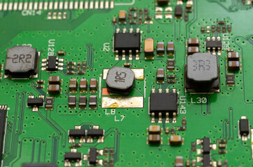 Obraz premium Printed circuit boards with electronic components close-up, photo for a project about the development of modern technologies, engineering and production, high detail.