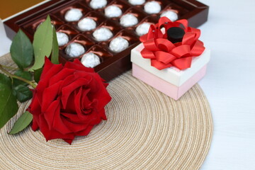 A beautiful rose, a small gift, a heart and a box of chocolates will make us happy any day