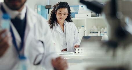Scientist, laptop and woman with tablet in lab for cancer research, test results or innovation....