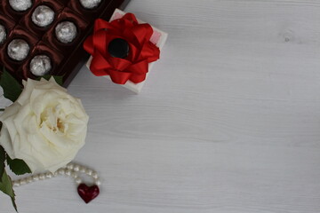 A beautiful rose, a small gift, a heart and a box of chocolates will make us happy any day