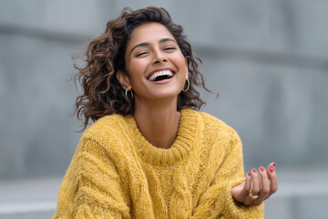 close up of young indian woman laughing