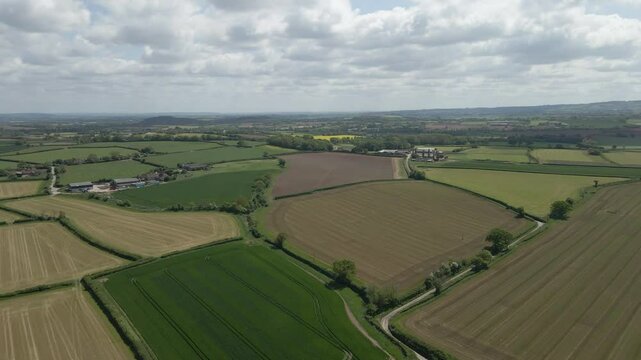 Arial view of Stogursey parish in the quantock hills Somerset. Drone moving forward over the fields and in direction to the quantock hills. 4K, 60fps