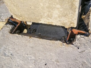 Detailed shot of concrete structure with metal support, showing welding, and strong build.