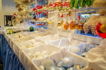 White and light blue Christmas ornament store at a festive Christmas market store booth in Essen, Germany
