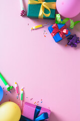 Vertical Birthday Party Background. A festive arrangement of colorful gifts, balloons, and party favors on a pink surface with copy space