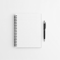 spiral-bound notebook with ballpoint pen beside it on white background