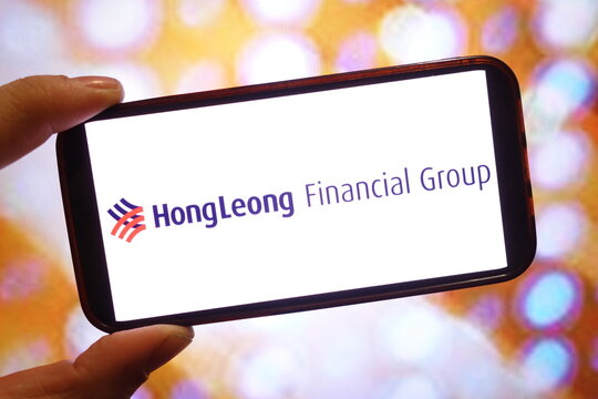 Konskie, Poland - April 06, 2025: Hong Leong Financial Group company logo displayed on mobile phone