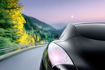 Black Sports Car on a Mountain Road at Twilight