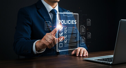 Naklejka premium Man in suit interacting with digital policies checklist near laptop on a dark background scene