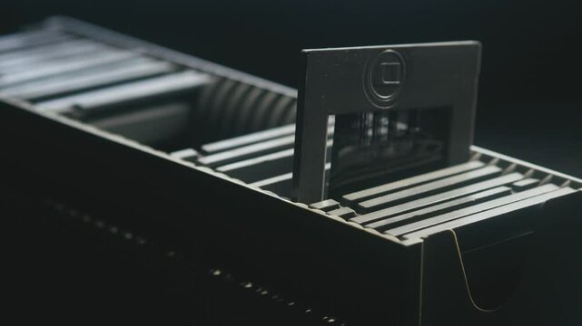 Photo slide show storage case with diapositive film. CLOSE-UP SLIDE