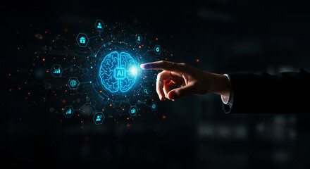 Fototapeta premium A hand touching a glowing brain with ai in the center surrounded by icons on a dark background
