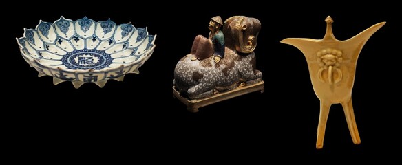 A collection of antique Asian artifacts: a blue and white porcelain lotus bowl, a bronze sculpture...