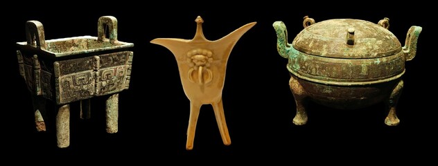 Ancient bronze vessels, possibly ritualistic, showcase intricate designs and varying shapes.  They...