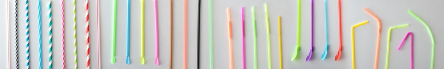 Collection of drinking straws of different colors shapes and designs