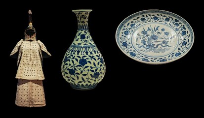 Ancient Chinese artifacts: a ceramic armor, a porcelain vase, and a decorative plate, all showcasing intricate blue and white designs.  The pieces exhibit exquisite craftsmanship and represent a signi