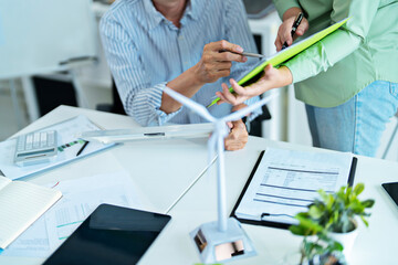 Corporate team researching sustainable alternatives for carbon reduction and clean energy growth