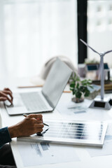 Businessman planning clean energy in modern workspace