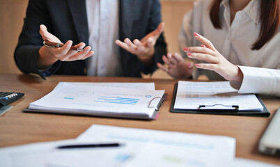 Mentor coaching new office trainee under supervision of senior employee in company workplace...