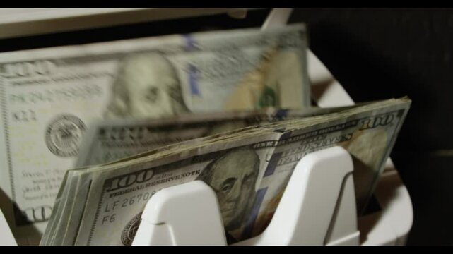 Counting cash. Dollar bills motion. Cash machine count dollar in action. Dollars paper money. Counting 100 dollar bills. Easy money. Counting machine with dollar bill. Money counter. Banking concept.