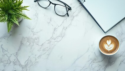 A minimalist workspace, featuring a cup of coffee, eyeglasses, and a notebook, on a marble surface