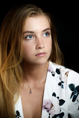 Portrait of beautiful sensual woman with blue eyes. Studio shot.