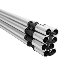 Fototapeta premium Silver metal tubes with black braided cables bundled together. Ideal for industrial design, engineering, or electrical system visuals.