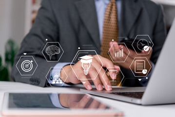 Corporate training man in suit interacting with digital learning and analytics icons, showcasing smart goals, innovation, planning, and business intelligence tools. business development.