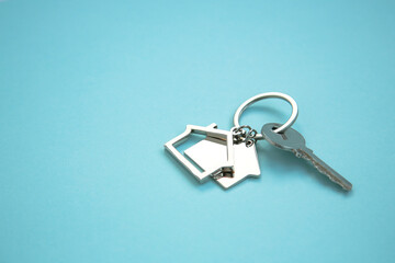 keys on a blue background. concept of insurance, financing, housing, administrative buildings and business. Copy space