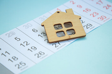 house on a calendar. Real estate purchase , mortgage loan repayment time, housing tax payment deadline, concept. Copy space