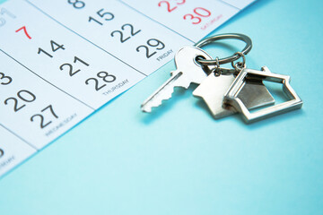 house keys on a calendar , . Real estate purchase , mortgage loan repayment time, housing tax...