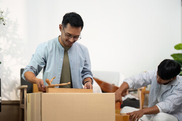 Gay couple setting up their new home with love and care