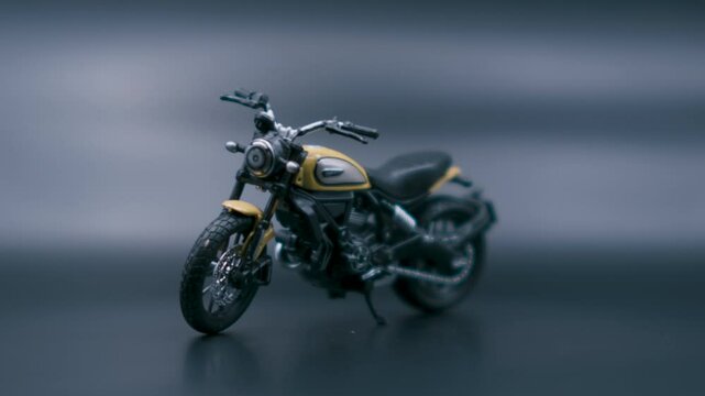 Ducati Scrambler 1:18 Diecast Model on Dark Background - Angle 1