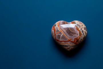 Heart of Stone on a Blue Background. Space for text.