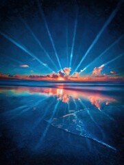 Sunrise over the beach, vibrant colors reflected in water