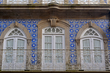 Facade of a building inside the fortress of Valença do Minho covered in tiles. The art and tradition of tiling is a legacy of the Arab peoples who inhabited the Iberian Peninsula