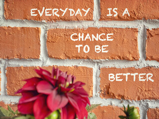 Everyday is a chance to be better text written on wall background. Stock photo.