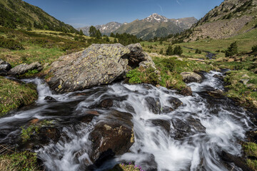 stream with meltwater flowing down the Sorteny valley, Sorteny Valley Natural Park, Ordino district, Andorra, Europe