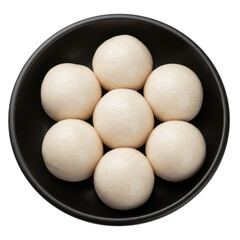Seven perfectly round, steamed buns arranged in a black bowl, overhead view.