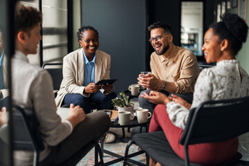 Group of Professionals Engaged in a Collaborative Meeting in a Modern Office